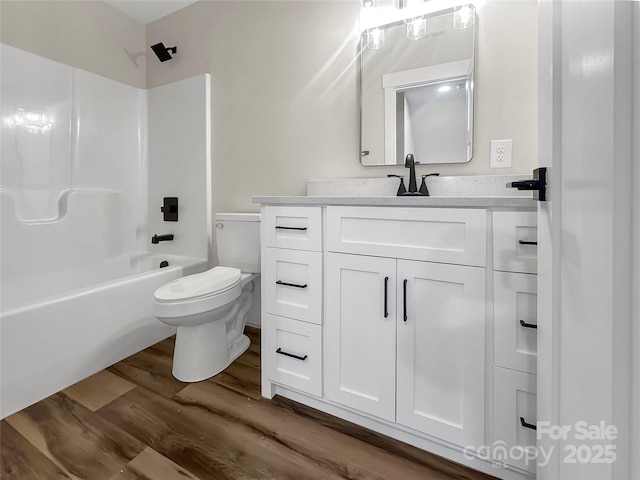 420 Fulton Dr, Kings Mountain, NC 28086 - full bathroom featuring wood finished floors, toilet, vanity, and shower / bathtub combination