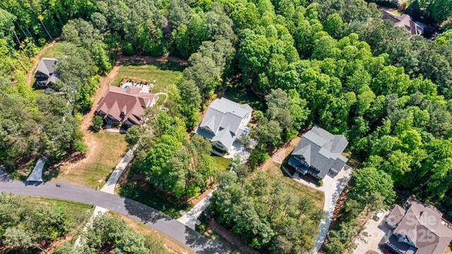 aerial view with a residential view and a view of trees