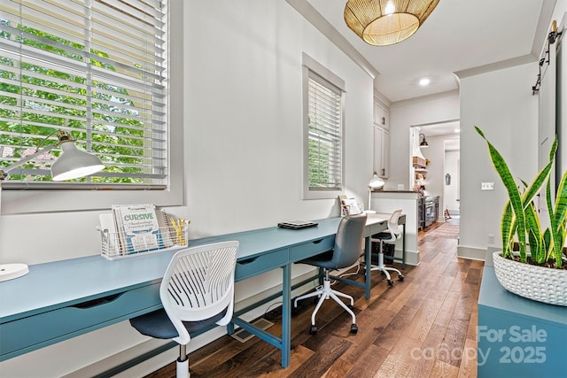 office space with wood-type flooring