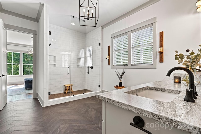 full bathroom with vanity, a stall shower, recessed lighting, and a notable chandelier