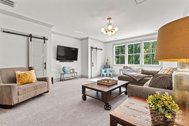 living area featuring visible vents, crown molding, baseboards, a barn door, and carpet flooring