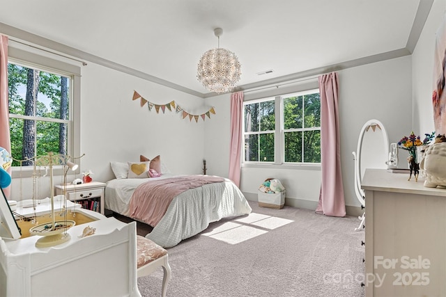 bedroom featuring baseboards, carpet flooring, and visible vents