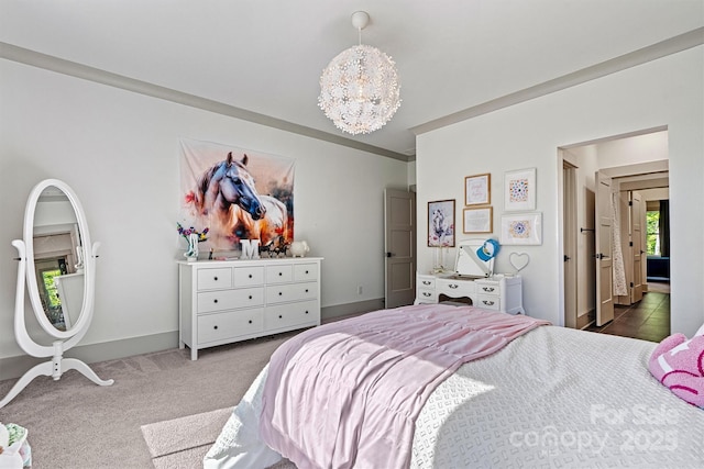bedroom featuring baseboards, a notable chandelier, and dark colored carpet