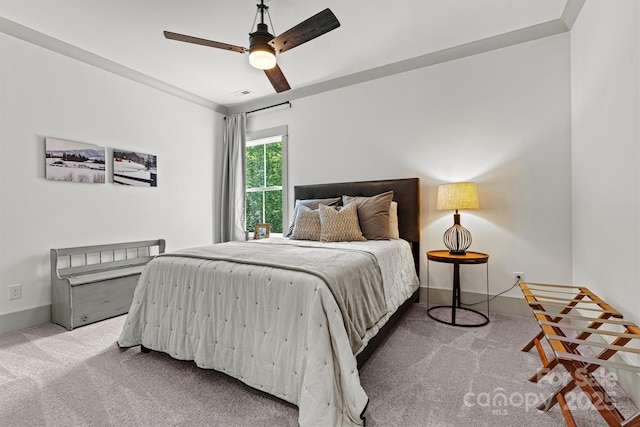 bedroom featuring carpet floors, a ceiling fan, baseboards, and visible vents