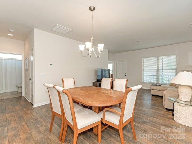 1026 Kirby Dr, Fort Mill, SC 29715 - dining space with dark wood-style flooring, a chandelier, and baseboards