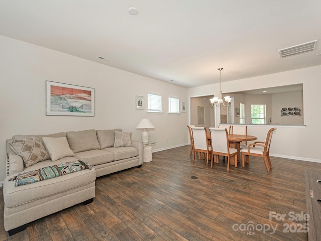 1026 Kirby Dr, Fort Mill, SC 29715 - living area with a chandelier, dark wood-type flooring, and baseboards