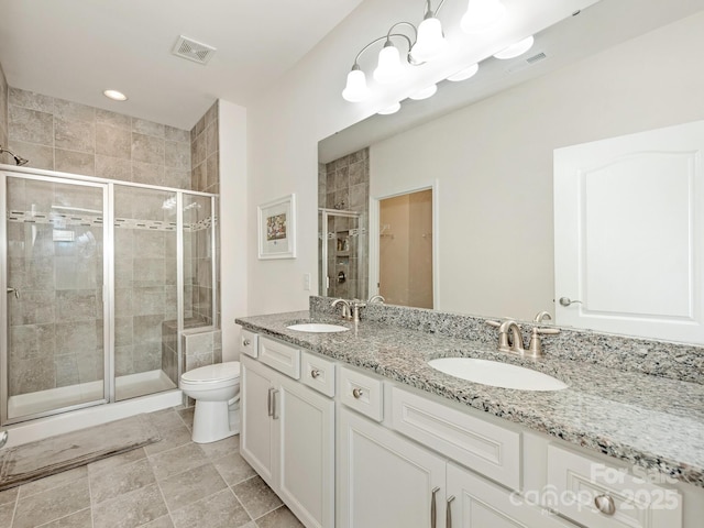 1026 Kirby Dr, Fort Mill, SC 29715 - bathroom with a stall shower, toilet, double vanity, and recessed lighting