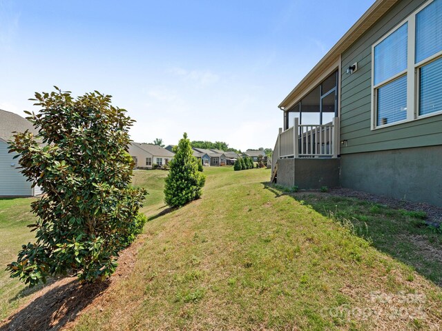 1026 Kirby Dr, Fort Mill, SC 29715 - view of grassy yard with a sunroom and a residential view