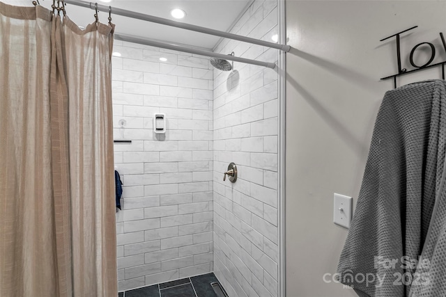 full bathroom with recessed lighting and a shower stall
