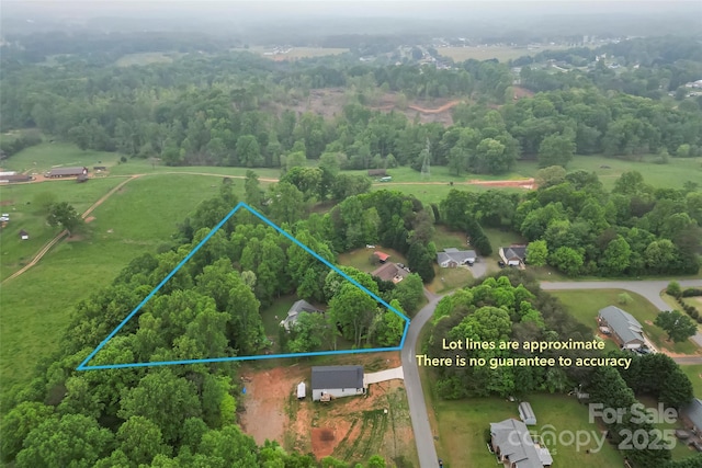 aerial view with a rural view and a forest view