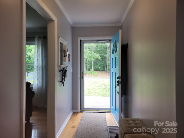 854 Silver Fox Dr, Concord, NC 28025 - doorway to outside featuring light wood-type flooring, ornamental molding, and baseboards