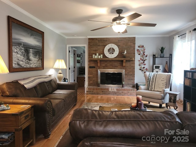 854 Silver Fox Dr, Concord, NC 28025 - living room with wood finished floors, a ceiling fan, a brick fireplace, and crown molding