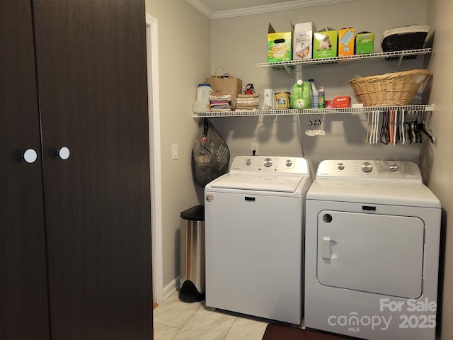 854 Silver Fox Dr, Concord, NC 28025 - clothes washing area featuring washer and clothes dryer, crown molding, and light marble finish flooring