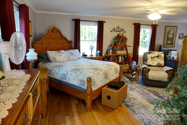 854 Silver Fox Dr, Concord, NC 28025 - bedroom with light wood-style flooring, crown molding, and a ceiling fan