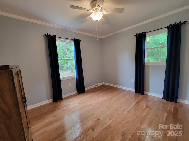 854 Silver Fox Dr, Concord, NC 28025 - empty room with light wood-style floors, ceiling fan, ornamental molding, and baseboards