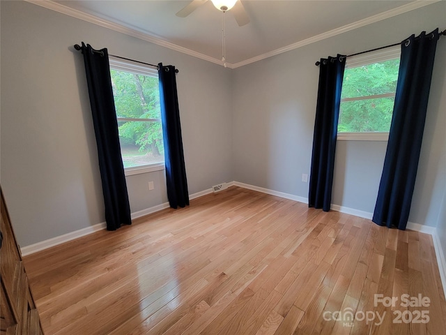 854 Silver Fox Dr, Concord, NC 28025 - unfurnished room featuring light wood-style floors, baseboards, a ceiling fan, and ornamental molding