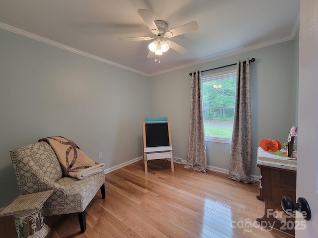854 Silver Fox Dr, Concord, NC 28025 - sitting room featuring ornamental molding, light wood finished floors, baseboards, and a ceiling fan