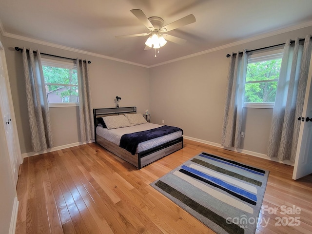 854 Silver Fox Dr, Concord, NC 28025 - bedroom with multiple windows, light wood-style flooring, baseboards, and ornamental molding