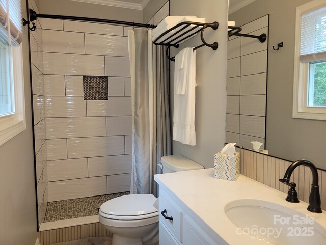 854 Silver Fox Dr, Concord, NC 28025 - bathroom featuring ornamental molding, toilet, a tile shower, and vanity
