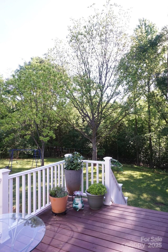 854 Silver Fox Dr, Concord, NC 28025 - wooden deck featuring a lawn and a playground