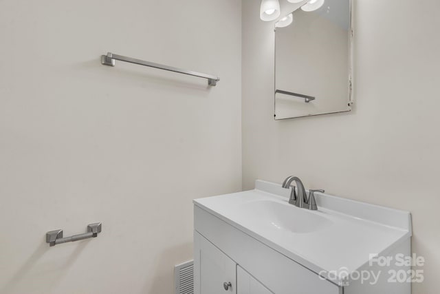 bathroom featuring visible vents and vanity