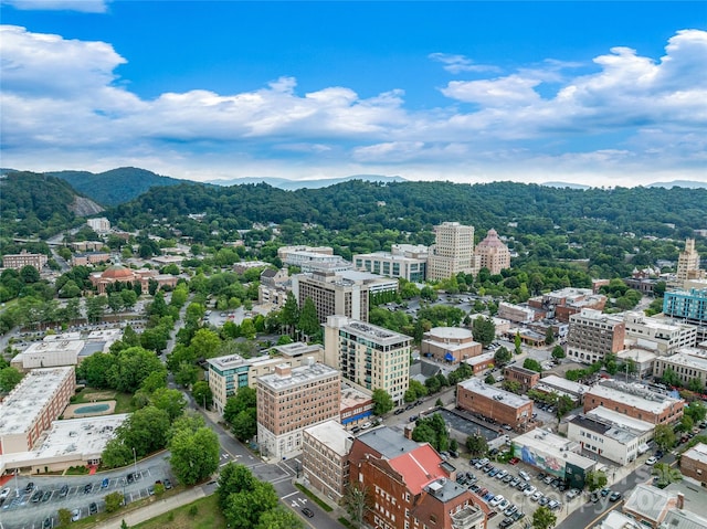 aerial view featuring a view of city and a mountain view