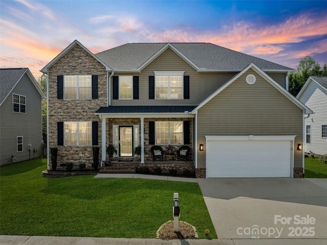 3 Holmes Ln, Arden, NC 28704 - view of front facade with a porch, a shingled roof, a yard, driveway, and stone siding