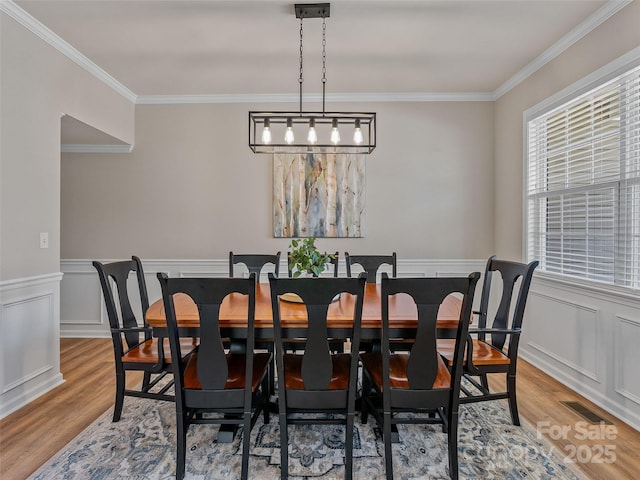 3 Holmes Ln, Arden, NC 28704 - dining area featuring ornamental molding, visible vents, and light wood-style flooring