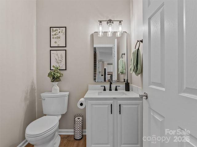 3 Holmes Ln, Arden, NC 28704 - bathroom with toilet, wood finished floors, vanity, and baseboards