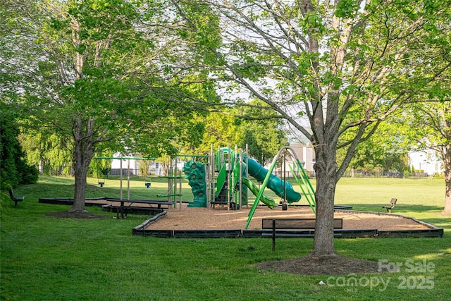 communal playground featuring a yard