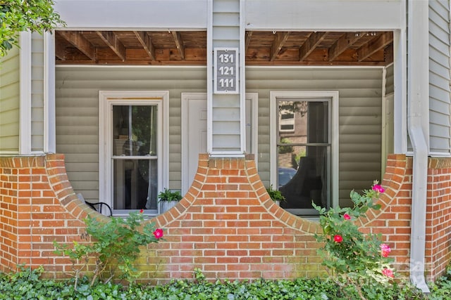 property entrance with brick siding