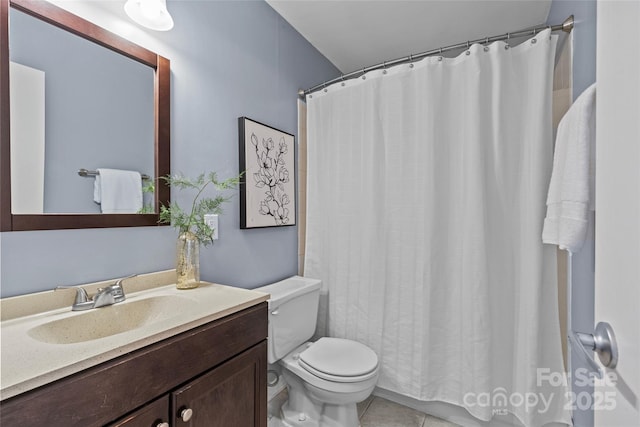 full bathroom featuring toilet, curtained shower, tile patterned flooring, and vanity