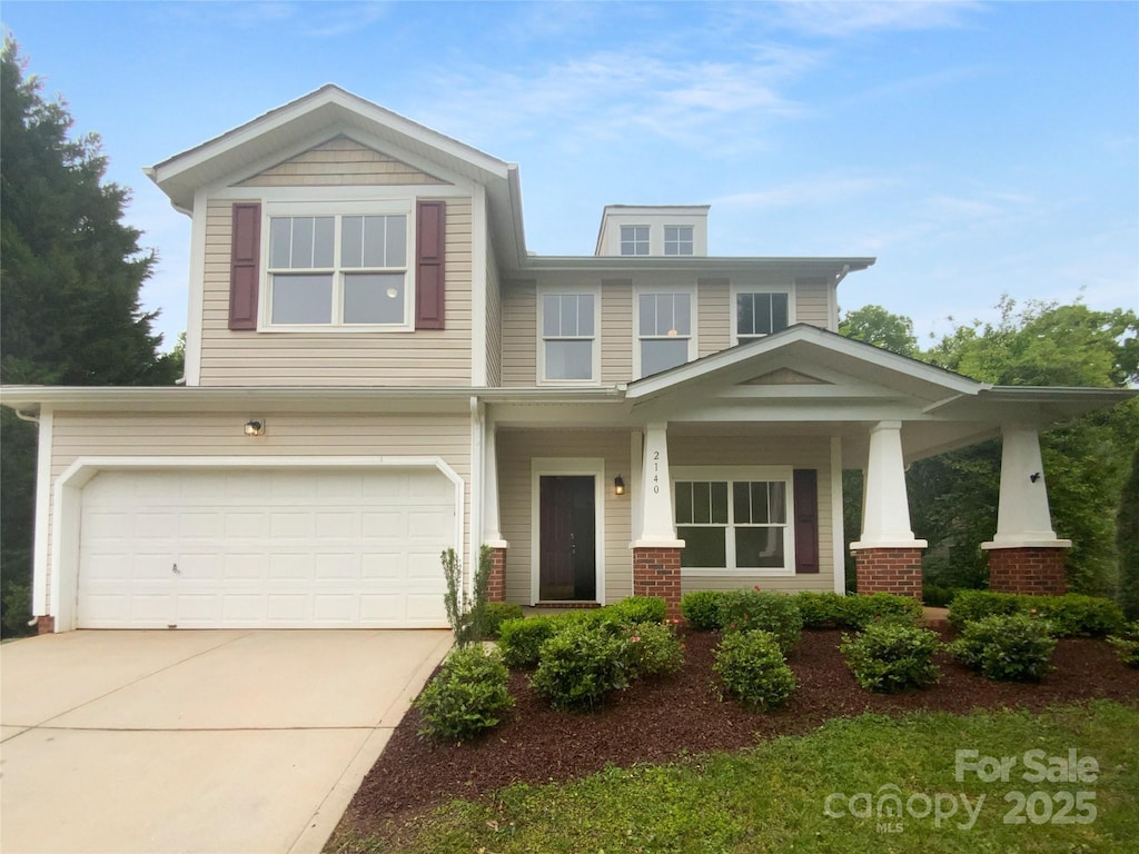 2140 Majestic Poplar Dr, Waxhaw, NC 28173 - craftsman-style house with a garage, a porch, and driveway
