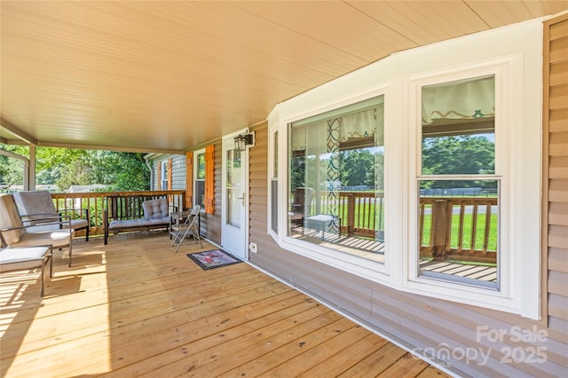 1005 Caldon Dr, Stanley, NC 28164 - wooden porch with an outdoor living space