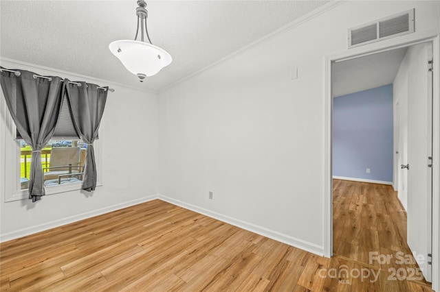 1005 Caldon Dr, Stanley, NC 28164 - empty room with light wood finished floors, crown molding, and a textured ceiling