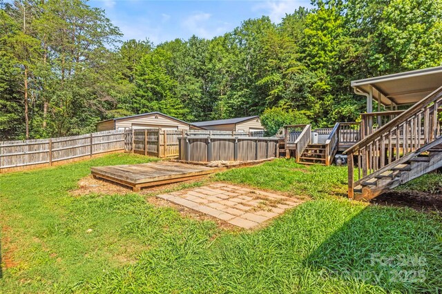 1005 Caldon Dr, Stanley, NC 28164 - fenced backyard featuring a deck and stairway