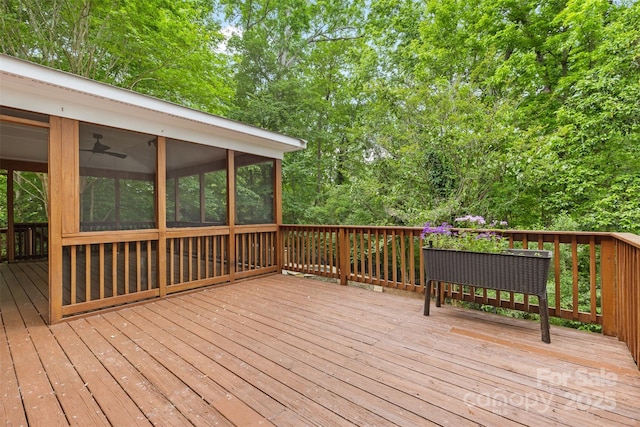 wooden deck featuring a sunroom