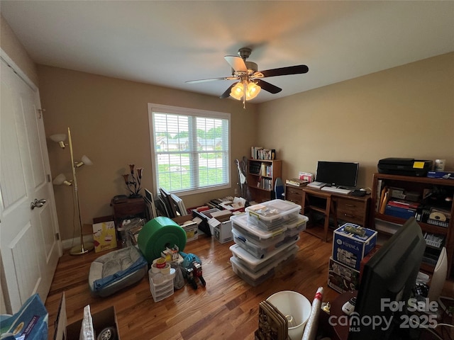 office area featuring a ceiling fan and wood finished floors