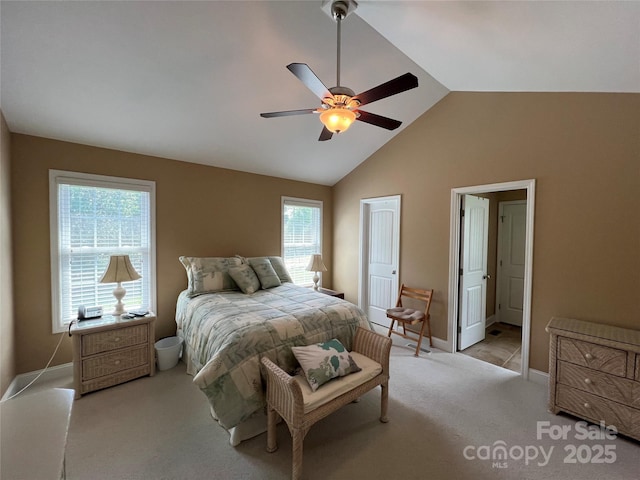 bedroom featuring baseboards, ceiling fan, light carpet, and high vaulted ceiling