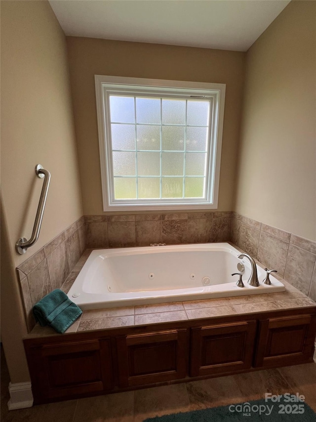 full bath with a whirlpool tub