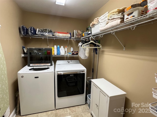 laundry room featuring washer and dryer and laundry area