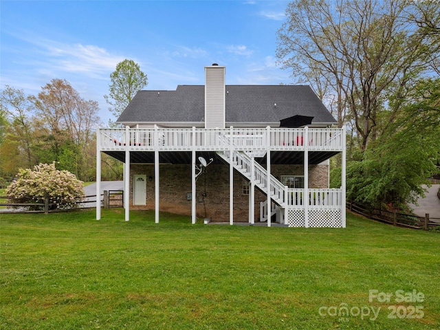 103 Higgins Rd, Fletcher, NC 28732 - back of property with fence, a wooden deck, a chimney, and a lawn