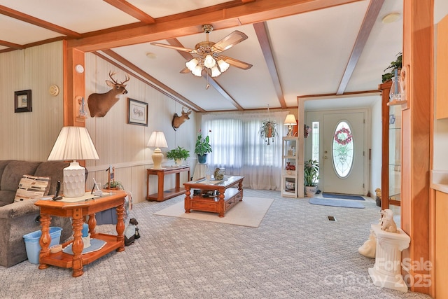 carpeted living room with beam ceiling and ceiling fan