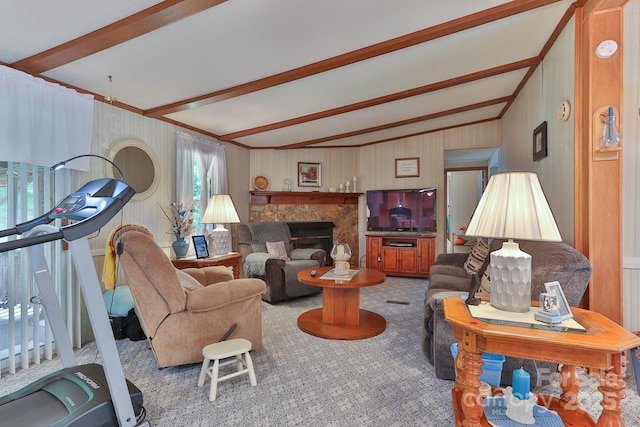 living area featuring lofted ceiling with beams and carpet