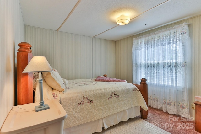 bedroom with light colored carpet