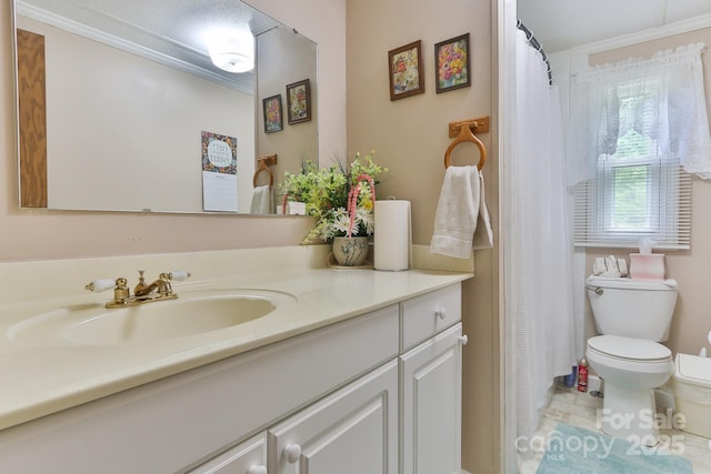 bathroom featuring vanity, toilet, crown molding, and a shower with curtain