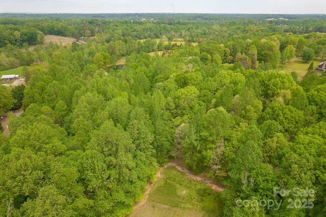 bird's eye view featuring a view of trees