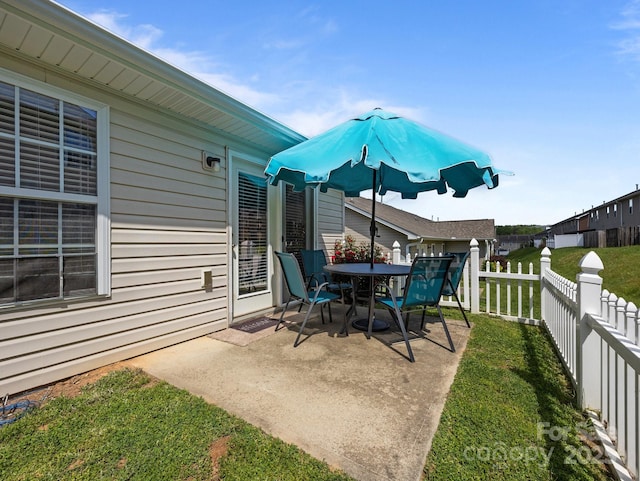 view of patio featuring fence private yard and outdoor dining space