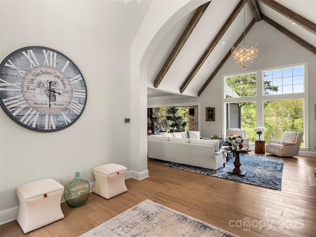 41 Bear Flower Trl, Arden, NC 28704 - living room featuring high vaulted ceiling, beam ceiling, wood finished floors, baseboards, and a chandelier