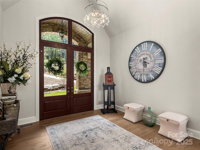 41 Bear Flower Trl, Arden, NC 28704 - entryway featuring vaulted ceiling, french doors, wood finished floors, baseboards, and a chandelier